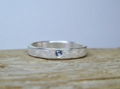 This 3mm wide sterling silver ring is hand-hammered with a rustic texture and set with a 2mm Yogo Sapphire. Perfect for stacking or as a simple accent to a any style. Sizes 4 to 9 are available with a note at checkout. Yogo Sapphire, Boho Wedding Ring, Casual Rings, Rustic Texture, Hammered Silver Ring, Silver Rings With Stones, Sterling Silver Wedding Band, How To Make Rings, Sterling Silver Rings Bands