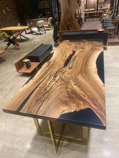 a table made out of wood and metal with an artistic design on it's surface