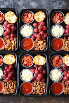 six trays filled with different types of food