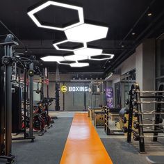 the inside of a gym with rows of exercise equipment