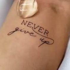 a tattoo that says never give up