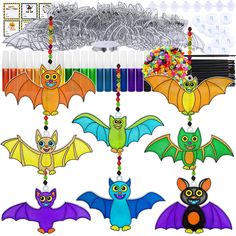 an assortment of colorful bats hanging from strings