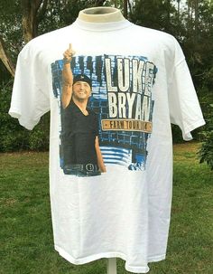 a white t - shirt with a photo of luke brown on the front and back