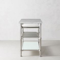 two tiered metal and glass side tables with white marble top, one on each side