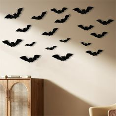 the bats are hanging on the wall in the room