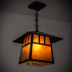 a lamp hanging from the ceiling in a room