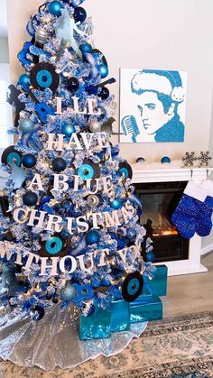 a christmas tree decorated with blue and silver ornaments