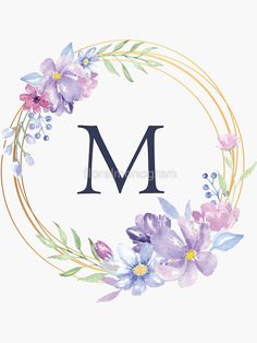 the letter m is surrounded by purple flowers and greenery in a gold circle frame