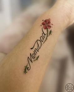 a woman's arm with a tattoo that says monday on it and flowers in the middle