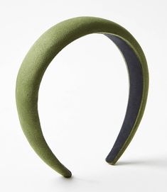 a close up of a green headband on a white background with no people around it