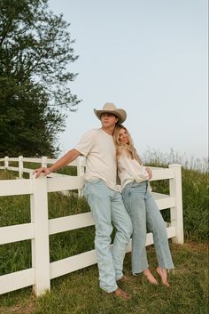 Engagement photo couple session cowboy hat engagement ring golf course wrangler jeans kissing sunset hugging photography white fence Fence, A Man, White