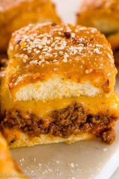 cheeseburger sandwich cut in half on a plate