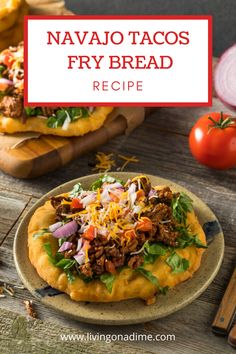 navajo tacos fry bread recipe on a plate with tomatoes, onions and other ingredients