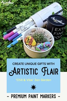 some markers and pens are sitting in a bowl on the ground with green plants behind it