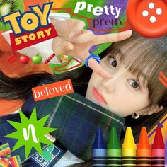 the girl is holding her hand up in front of colorful crayons and buttons