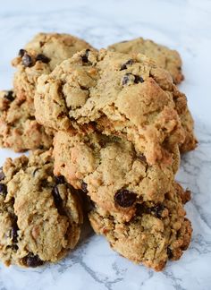 a pile of cookies sitting on top of a marble countertop next to each other