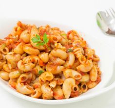 a white bowl filled with macaroni and cheese