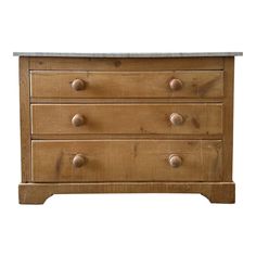 a wooden dresser with three drawers and two marble top knobs on the bottom drawer