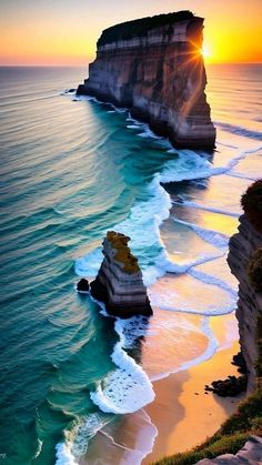 the sun is setting over the ocean with cliffs in the foreground and waves crashing on the beach