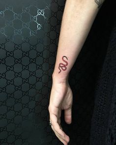 a person with a tattoo on their arm