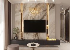 an elegant living room with marble walls and chandelier on the wall, large screen television