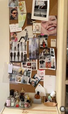 a cork board with pictures and photos on it