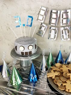 a cake and party decorations on a table