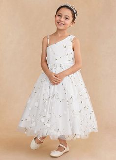 Ivilia is our sweet and joyful flower girl A-line dress made from our embroidered tulle. She features a one shoulder neckline. The A-line skirt has box pleating that creates a playful yet sophisticated silhouette. Junior Flower Girl Dresses, Girls White Dress, Ivory Flower, Tulle Flower Girl