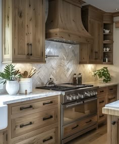 a kitchen with wooden cabinets and marble counter tops