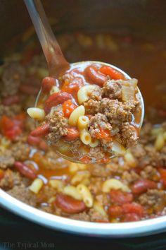 a ladle full of chili macaroni and cheese