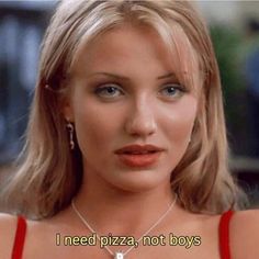 a woman in a red dress with a necklace on her neck that says i need pizza, not boys