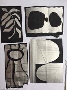 four pieces of paper with black and white designs on them