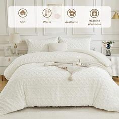 the bed is made with white comforters and pillows on top of it, along with other items