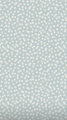 a blue and white wallpaper with stars on it