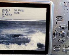 a close up of a digital camera with waves in the water on it's screen