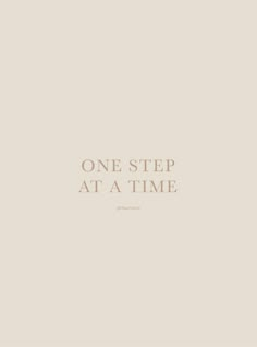 the words one step at a time are written in white on a beige background with a black