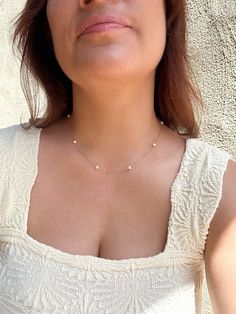 This delicate necklace holds a string of seven small natural off round white Pearls. This necklace is very versatile and is perfect for both special occasions or to elevate any casual outfit. The sensitive skin safe chain really shimmers! Pair it with the Floating Pearl Earrings or Tiny Stud Drops to create a stunning matching set! * 14K Gold Filled or 925 Sterling Silver chain & dainty spring clasp * Choose your length (with adjustable 2" extender chain) * 5mm natural off round Pearls * 14/20 gf or 925 stamp for authenticity * Made with 100% hypoallergenic materials 🤍 ✨ See all Pearl Jewelry here!: https://etsy.me/3zMbXyh GET TO KNOW MAGBEE JEWELRY! 🤍 All MagBee pieces are safe for sensitive skin and made with hypoallergenic Gold Filled or 925 Sterling Silver. 🤍 I only use real/natural Pearl Necklace Real, Floating Pearl Necklace, Multi Gemstone Bracelet, Chunky Pearls, Real Pearl Necklace, Pearl Chain Necklace, Gems Bracelet, Basic Jewelry, Pearl Choker Necklace