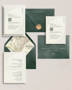 the wedding stationery is set on top of green envelopes, and features a map