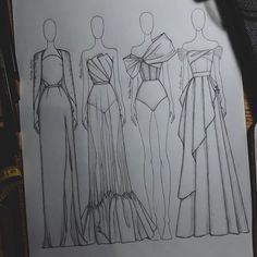 an image of three dresses drawn on paper