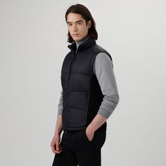 Water repellent quilted nylon vest with melange knit fabric back, padded high standing collar with stow-away hood, thermal insulation, two-way zipper closure and pockets. Standing Collar, Quilted Vest, Thermal Insulation, Repellent, Water Repellent, Insulation, Knit Fabric, Knitted Fabric, Zipper