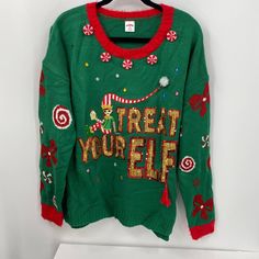 a green christmas sweater with the words treat yourself on it