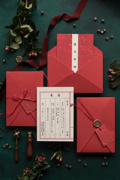 three red envelopes with ribbons tied around them