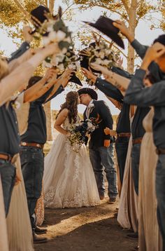 the bride and groom are surrounded by their friends