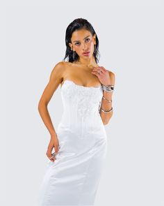 They’ll all be getting down on one knee when they see you in this dress 💍 Made from soft satin fabric, this gorgeous white lace appliqué gown, complete with a fit and flare style and corset boning, will leave a trail of admirers in your wake 🤍 Down On One Knee, Corset Boning, Black Off Shoulder, Graphic Top, White Jersey, Pocket Pants, Lace Applique, White Mini Dress, Satin Fabric