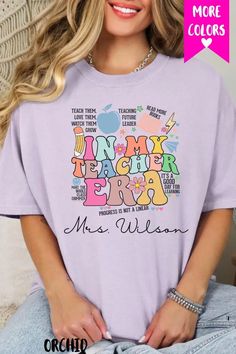 a woman wearing a purple t - shirt with the words junior teacher era on it