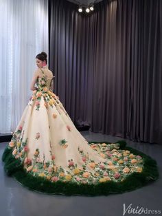 a woman in a dress made out of flowers