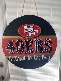 a sign hanging from the side of a door that says, fortyers faithful to the bay