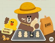 a brown teddy bear wearing a yellow hat and holding a bag next to some cookies