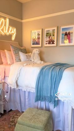 a bedroom with a bed and pictures on the wall