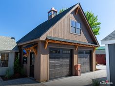 a two car garage with a steeple on top